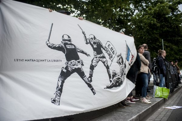 LILLE, FRANCE – JULY 4: Activists against the reform of labor law have meetings before the Gymnasium. 5 activists hold a banner depicting a fresco against police violence in Lille, France on july 4.
Supporters of the policy of the socialist government, led by Stéphane Le Foll and Patrick Kanner in the region held a meeting Monday night in Lille Gym, to restore confidence to the militants and provide them with arguments.